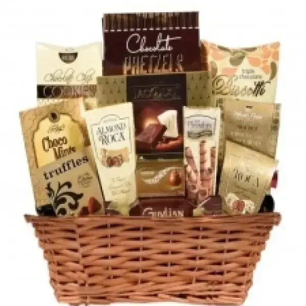 A wicker basket filled with various gourmet chocolate treats and packages.