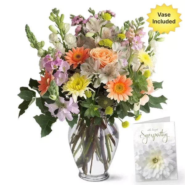 A colorful bouquet with a 'With deepest Sympathy' card, vase included.