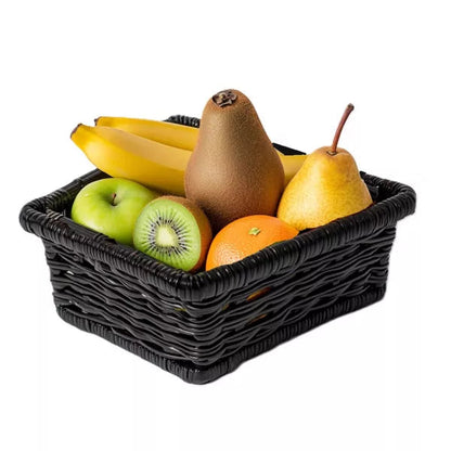 A black woven basket filled with fresh fruits; bananas, a kiwi, an orange, and two types of pears.
