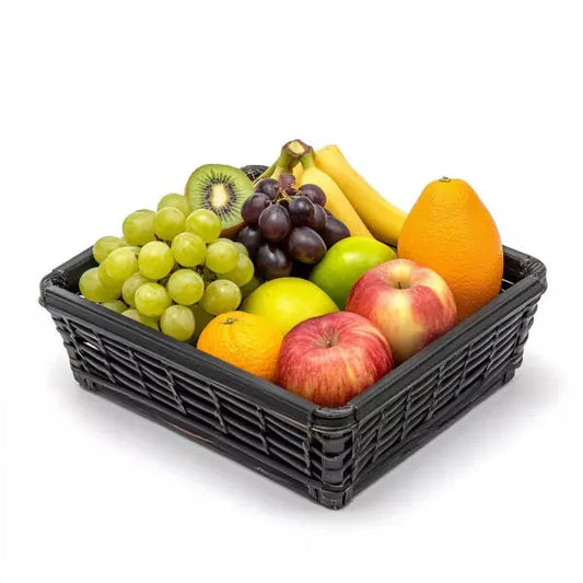 A basket filled with various fresh fruits on a white background.