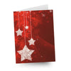 Red holiday card with sparkling stars and snowflakes.